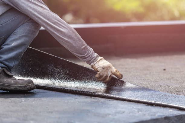 Professional Emergency Waterproofing technician working in Macomb, IL